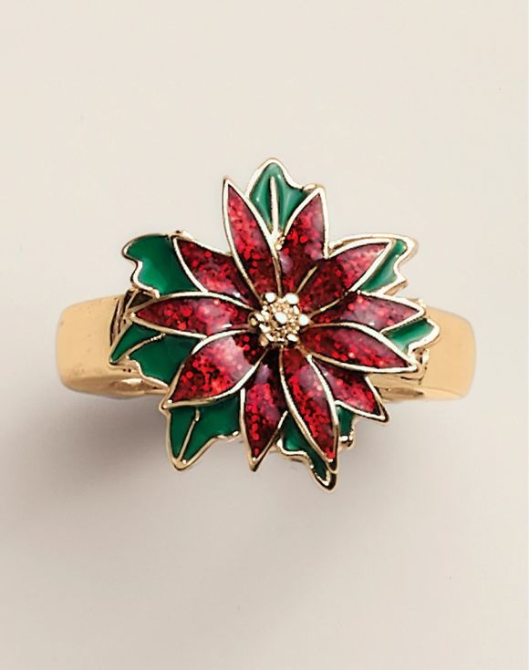 Gold ring featuring a colorful flower design with red petals and green leaves.